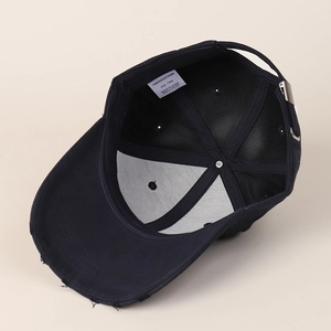 Classic black solid cotton baseball cap showing internal structure and 100% cotton label