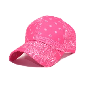 Detailed shot of rose pink paisley print baseball cap with classic curved brim