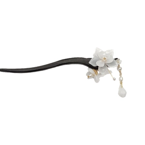 Elegant Magnolia wooden hair pin with white resin petals and delicate pearl tassels