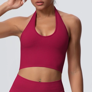 Detail of ribbed knit fabric on wine red halter sports bra and high waist yoga leggings