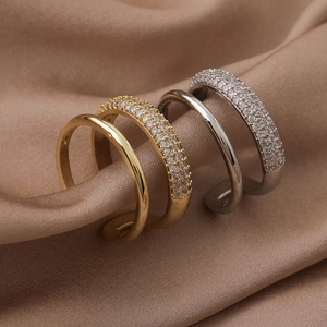 Double-layered open ring with micro-paved zircons on elegant brown satin fabric