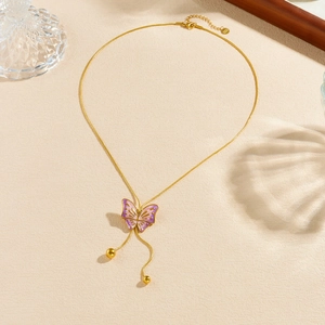 Elegant gold butterfly necklace with pink and purple enamel gradient and tassel beads