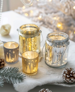 Christmas glass candle holders with gold and silver reindeer patterns for festive decor