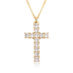 Macro view of gold cross pendant with micro-pave cubic zirconia on a fine chain