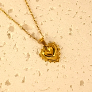 Gold vintage heart pendant necklace with 3D radial textured surface and thin metal chain