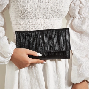 Elegant black evening clutch bag with vertical pleated texture for formal dinner parties