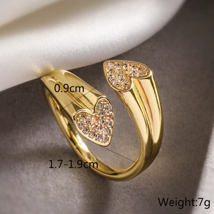 Macro shot of gold double heart ring with sparkling cubic zirconia and dimensions