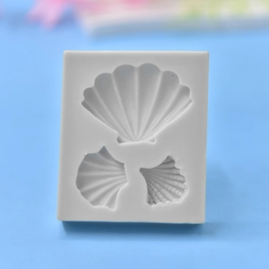 White silicone shell mold with three detailed sea conch designs for DIY baking crafts