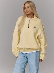 Sweat-shirt jaune pâle à col polo avec fermeture éclair cœur et broderie poitrine
