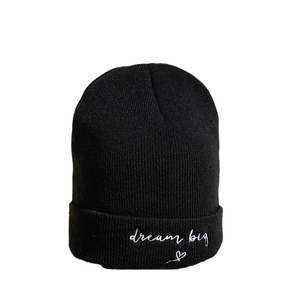 Classic black cuffed beanie with Dream Big embroidery and white heart detail for winter