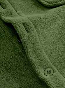 Macro detail of green fleece fabric texture with dark button on tactical jacket
