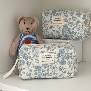 Quilted floral makeup bag set with blue begonia patterns and vintage cotton texture
