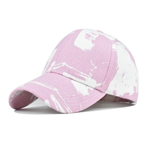 Detail view of tie-dye baseball cap with pink marble pattern and premium stitching