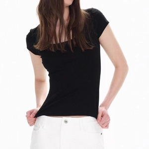 Detail view of the slim fit black U-neck T-shirt showing stretch fabric texture