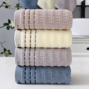 Thick waffle weave cotton face towels in a set of four Morandi colors with Fas ribbon