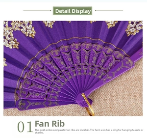 Detail of purple folding fan with gold floral pattern and durable gilt plastic ribs