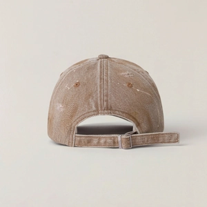 Detail view of the vintage washed baseball cap featuring distressed edges and adjustable strap