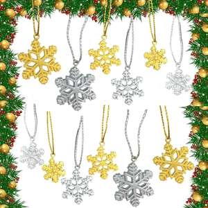 Glittery gold and silver snowflake ornaments in various sizes with festive Christmas decor