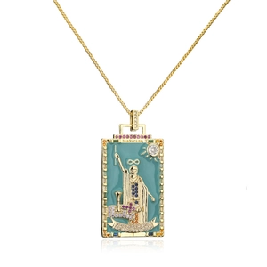 Detail of gold box chain and blue enamel Magician tarot card pendant with colored stones