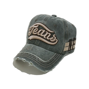Close-up of distressed gray-green denim baseball cap featuring 3D Jeans embroidery