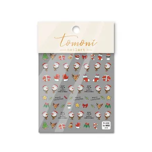 Détail d'autocollants 3D de Noël pour ongles avec motifs de renne et de bonhomme de neige