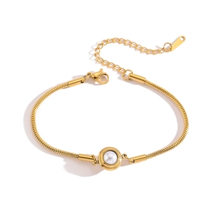 Gold plated snake chain bracelet featuring a central pearl accent for women, 45-degree view
