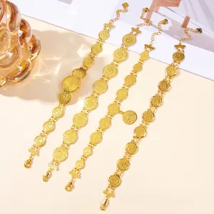 Set of four gold-plated coin link bracelets with lobster clasp and heart charm