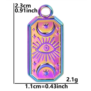 Macro view of rainbow stainless steel evil eye pendant with sun moon and star motifs