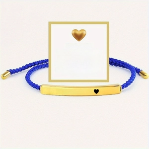Adjustable woven rope bracelet with gold engraved bar featuring Just Breathe message
