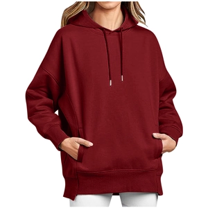 Detail of burgundy oversized hoodie showing kangaroo pocket and ribbed cuffs for women