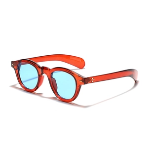 Vintage round sunglasses with transparent red frames and blue lenses for men and women