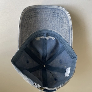 Inside view of washed cotton baseball cap with reinforcement strips and size label