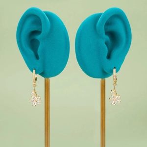 18k gold plated floral earrings with marquise-cut crystals on turquoise display stands