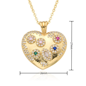 Detailed view of gold heart pendant with multi-color gems and 27mm height dimension