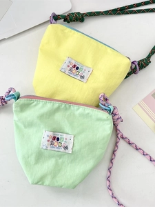 Mini casual crossbody phone bag in yellow and green with colorful braided straps