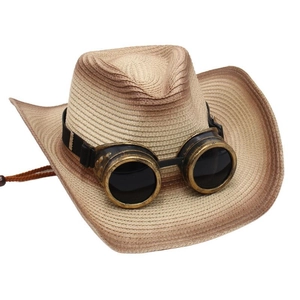 Détail d'un chapeau de cow-boy en paille avec lunettes steampunk et montures vintage