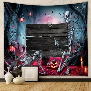 Detail of Halloween tapestry with skull, pumpkin lantern and moon in a room