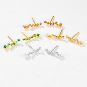 Detailed view of curved s925 silver stud earrings with colorful zircon inlay