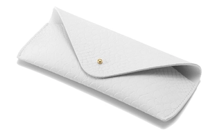 Detail of white snakeskin texture leather eyeglass case with gold button closure