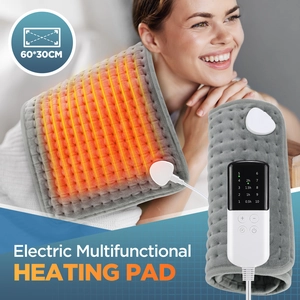Macro view of grey flannel electric heating pad showing soft texture and digital controller