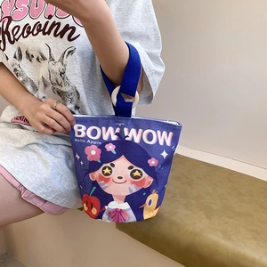 Purple canvas bucket bag with cartoon illustrations and wooden circular handle detail