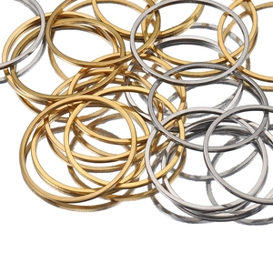 Close-up of gold and silver stainless steel O-rings for DIY jewelry making and bags