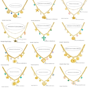 Collection of 12 gold necklaces with assorted sun, star, and heart charms in 3x4 grid
