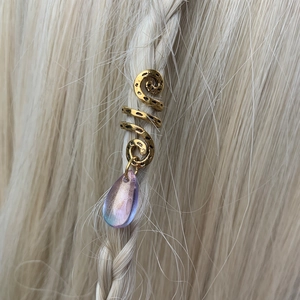 Golden spiral hair coil with iridescent pink and blue crystal drop pendant on braid