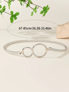 Detail showing elastic silver metal waist belt with double ring buckle and 67-85cm size