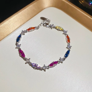 Detailed close-up of adjustable silver bracelet with colorful marquise-cut zircons