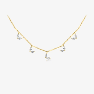 Elegant gold leaf pendant necklace featuring marquise cut zircon leaves on a delicate chain