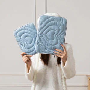 Quilted heart pattern light blue laptop sleeve set in 11 and 13 inch sizes with white trim