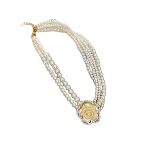 Multi-layer white pearl necklace featuring a luxury resin rose pendant with diamond accents