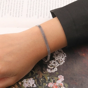 S925 sterling silver woven mesh bracelet for women worn in a vintage lifestyle setting
